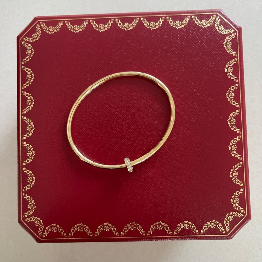 CARTIER Juste un Clou bracelet, small, size 15
Yellow Gold + Diamonds 0.18 carat
